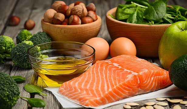 Closeup of salmon nuts and other foods that are good sources of healthy fats